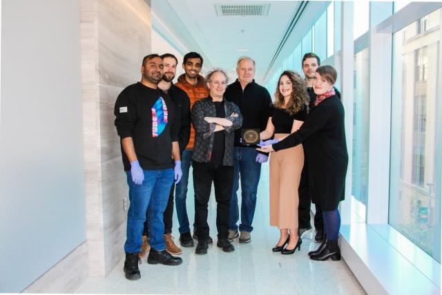 Part of the HUMANS team poses with the nanowafer. Left to right: Nikhil Uday Singh, Jan Onchoke Tiepelt, Somayajulu…